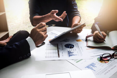 Business people using pen,tablet,notebook are planning a marketing plan to improve the quality of their sales in the future. Business people using pen,tablet,notebook are planning a marketing plan to improve the quality of their sales in the future.