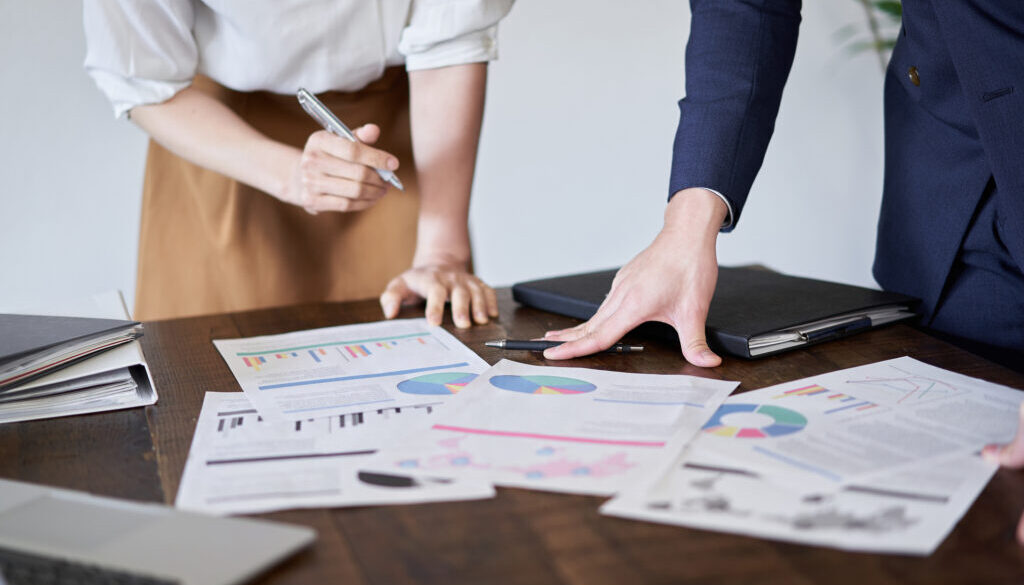 Asian business person having a meeting with paper materials