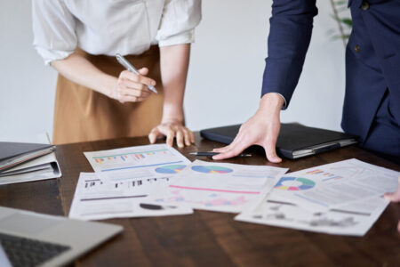 Asian business person having a meeting with paper materials Asian business person having a meeting with paper materials